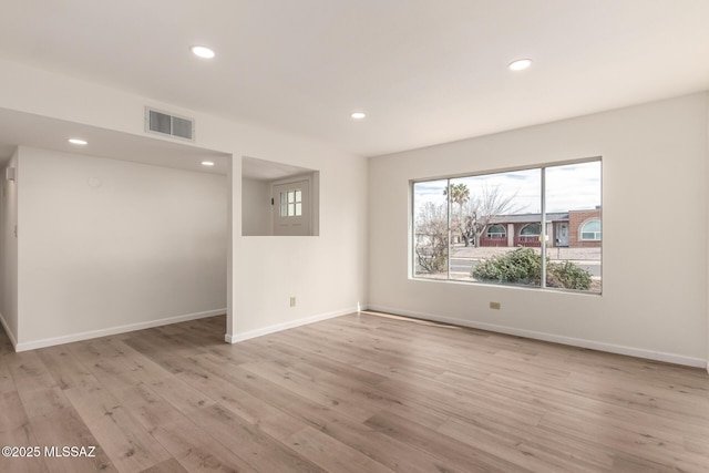 unfurnished room featuring light hardwood / wood-style floors