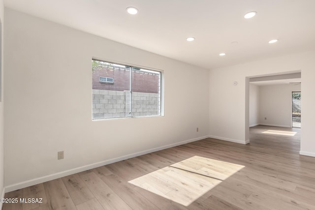 unfurnished room featuring light hardwood / wood-style flooring