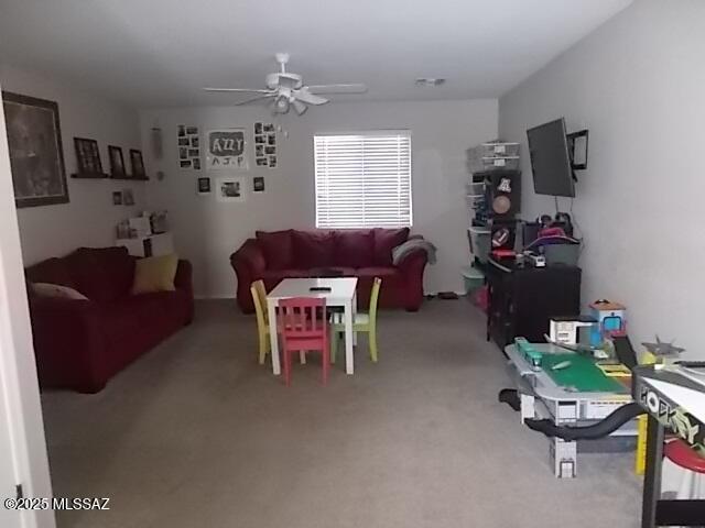 living room with ceiling fan