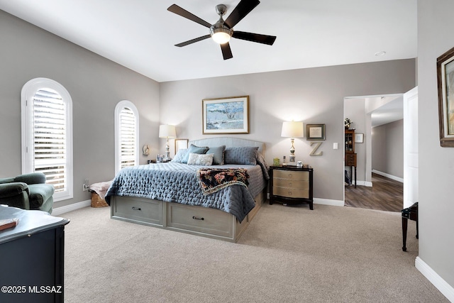 bedroom with ceiling fan and carpet flooring