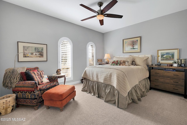 bedroom with light colored carpet and ceiling fan