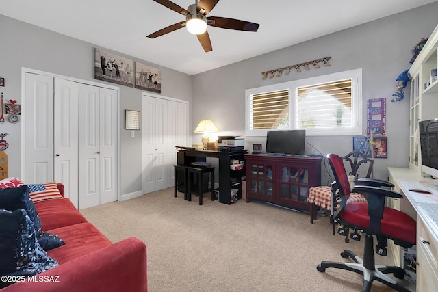 office area with light carpet and ceiling fan