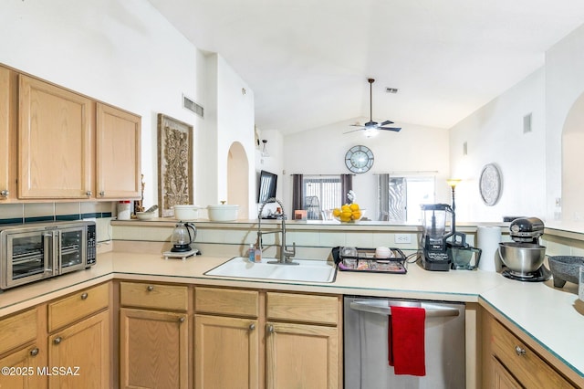 kitchen with a toaster, visible vents, dishwasher, light countertops, and a sink