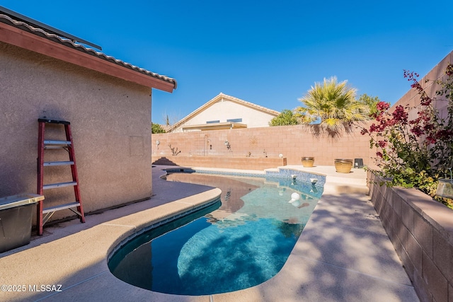 view of swimming pool featuring a patio area, a fenced backyard, and a fenced in pool