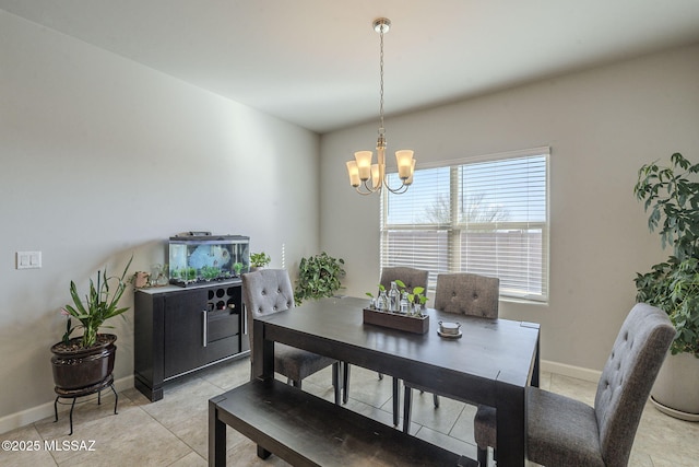 tiled dining room with a notable chandelier