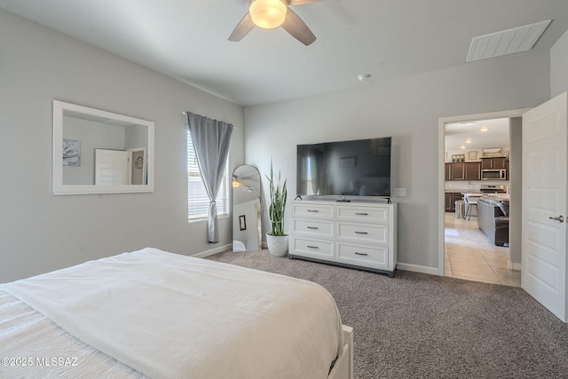 carpeted bedroom with ceiling fan