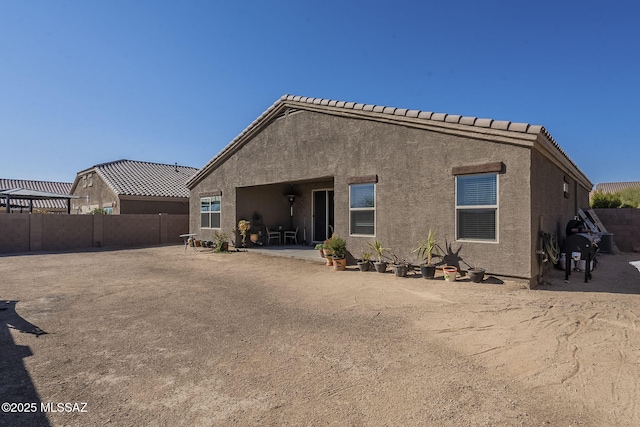 back of house featuring a patio