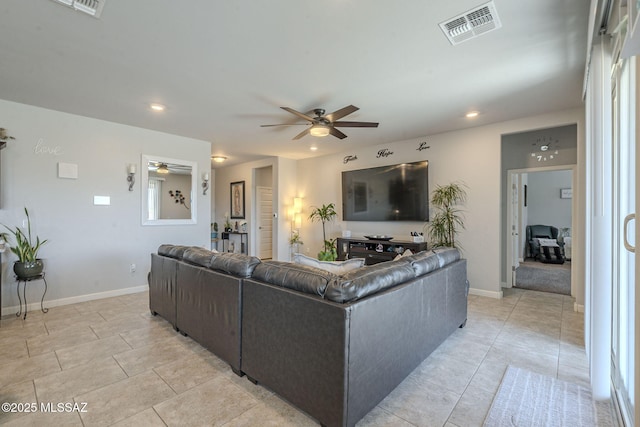 tiled living room featuring ceiling fan