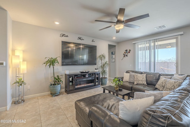 living room with ceiling fan and light tile patterned floors