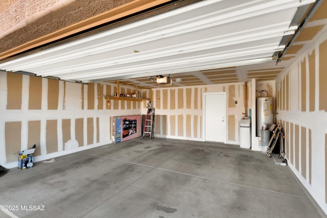 garage with a garage door opener and water heater