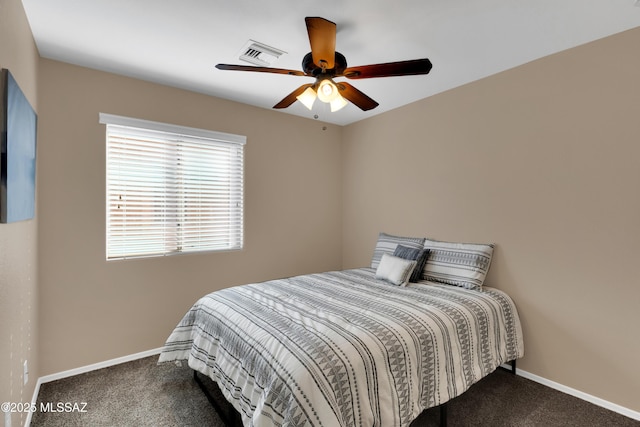 bedroom featuring carpet floors, baseboards, visible vents, and ceiling fan