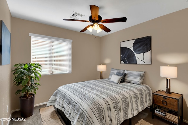 bedroom with ceiling fan, carpet, visible vents, and baseboards