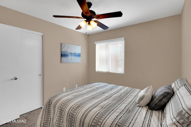 bedroom with ceiling fan, a closet, and carpet