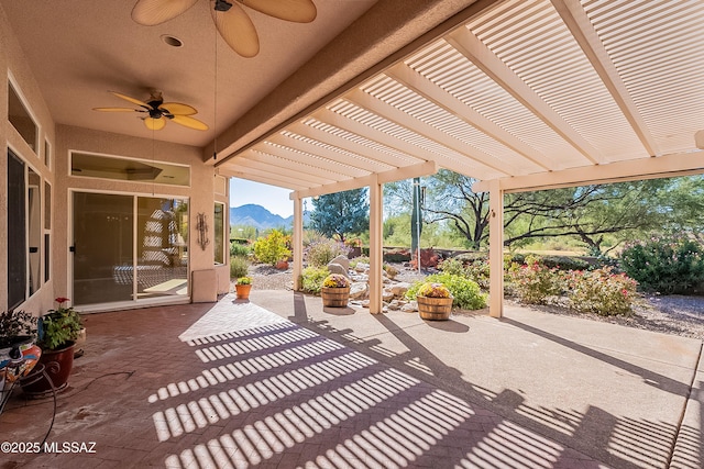 view of patio featuring a mountain view and a pergola