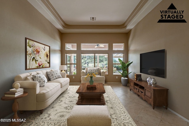 tiled living room with a towering ceiling