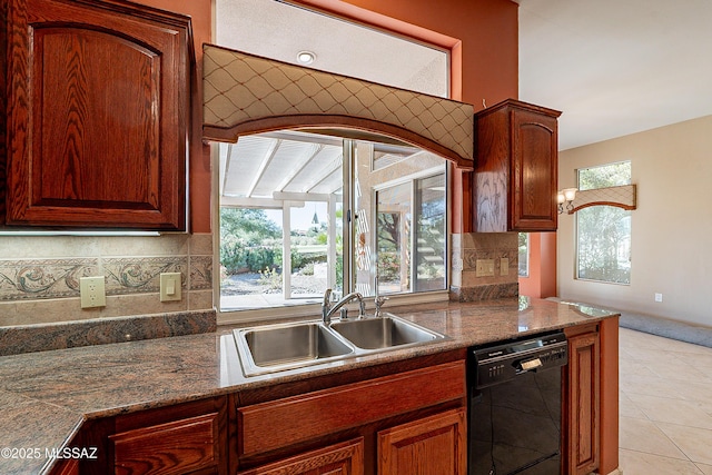 kitchen with tasteful backsplash, sink, black dishwasher, and light tile patterned flooring