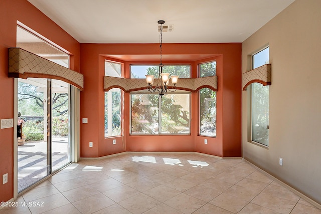 interior space with an inviting chandelier and light tile patterned floors