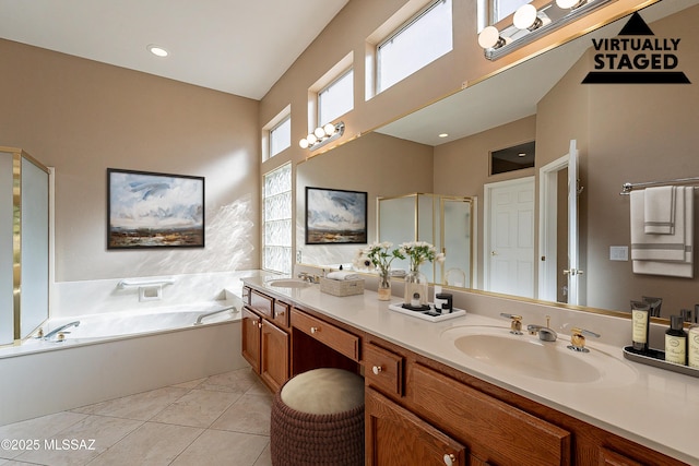 bathroom with vanity, tile patterned floors, and shower with separate bathtub