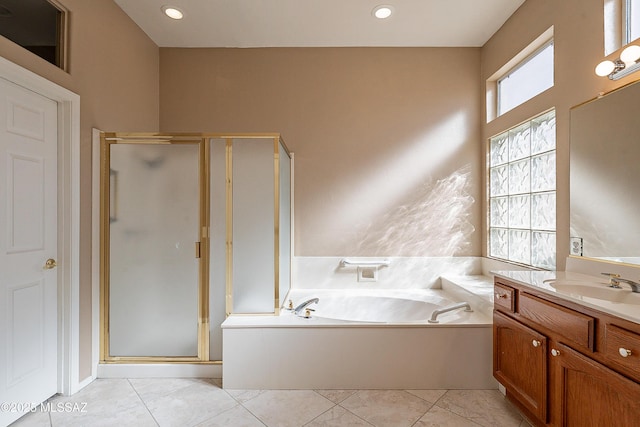 bathroom featuring tile patterned floors, vanity, and independent shower and bath