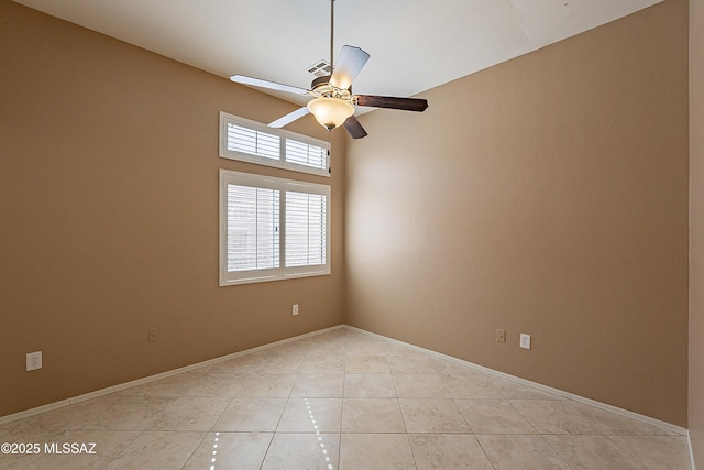 tiled empty room with ceiling fan