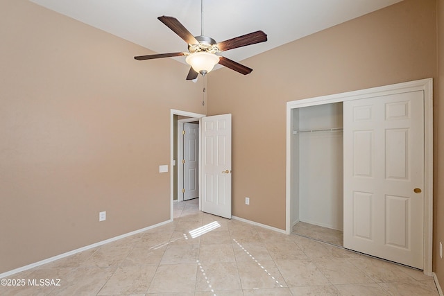 unfurnished bedroom with ceiling fan, a closet, and light tile patterned floors