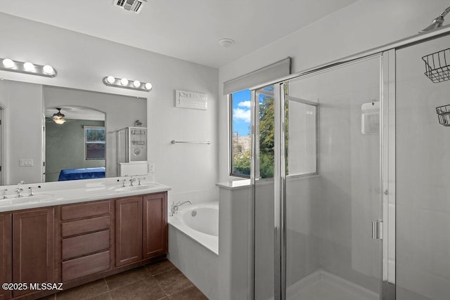 bathroom featuring vanity, tile patterned floors, plus walk in shower, and ceiling fan