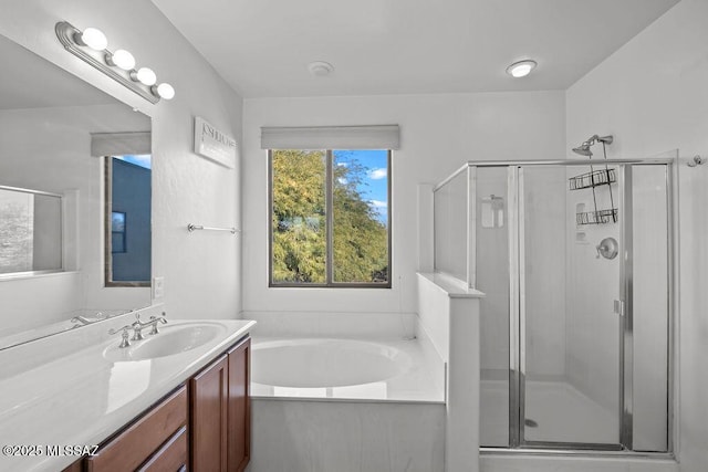 bathroom featuring vanity and separate shower and tub