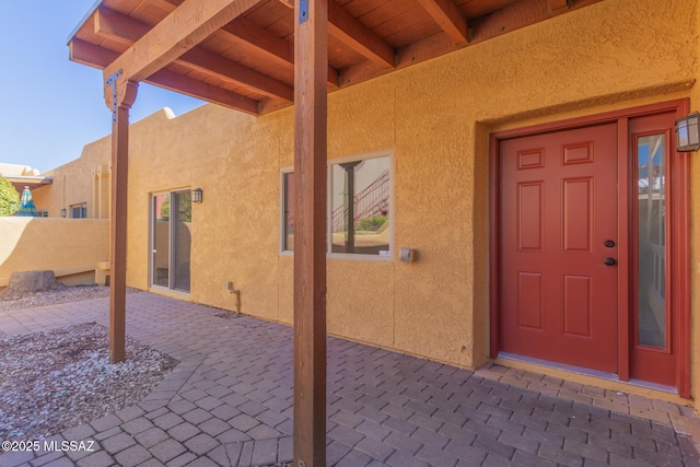 doorway to property with a patio