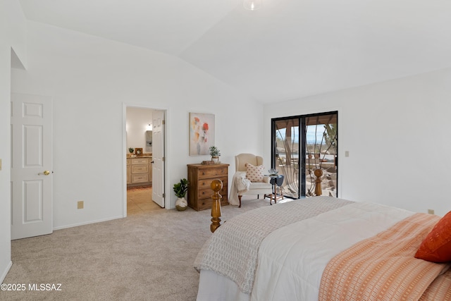 bedroom featuring access to exterior, lofted ceiling, light colored carpet, and connected bathroom