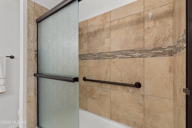 details featuring a shower with shower door