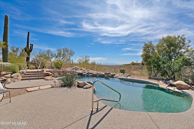 view of pool with a patio area, fence, and a fenced in pool