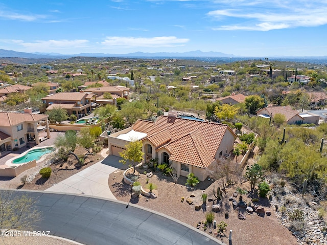 drone / aerial view with a residential view and a mountain view