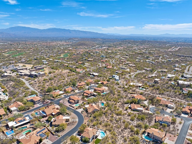 drone / aerial view featuring a residential view and a mountain view