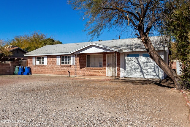 ranch-style house featuring a garage