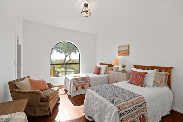 bedroom with hardwood / wood-style floors