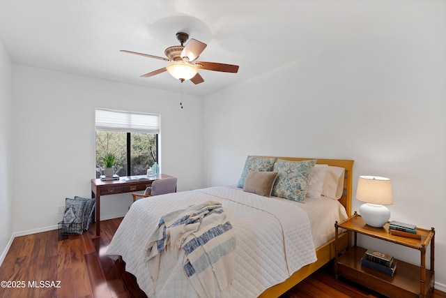 bedroom with ceiling fan and dark hardwood / wood-style floors