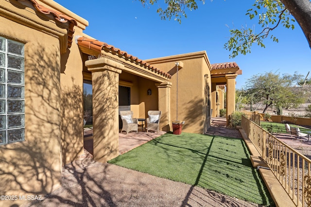 rear view of house featuring a patio