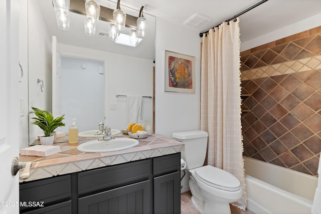 full bathroom featuring shower / bathtub combination with curtain, vanity, and toilet