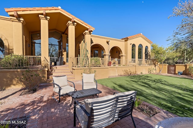 exterior space with a lawn and a patio area