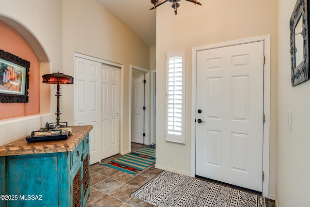 entryway featuring vaulted ceiling