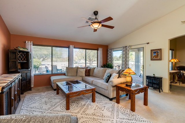 carpeted living room featuring lofted ceiling and ceiling fan