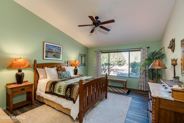 bedroom with lofted ceiling, dark hardwood / wood-style floors, and ceiling fan