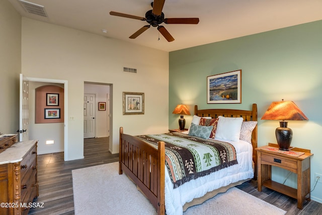 bedroom featuring dark wood-type flooring, ceiling fan, and lofted ceiling