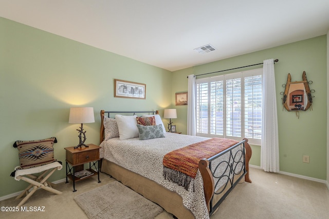 bedroom with light colored carpet