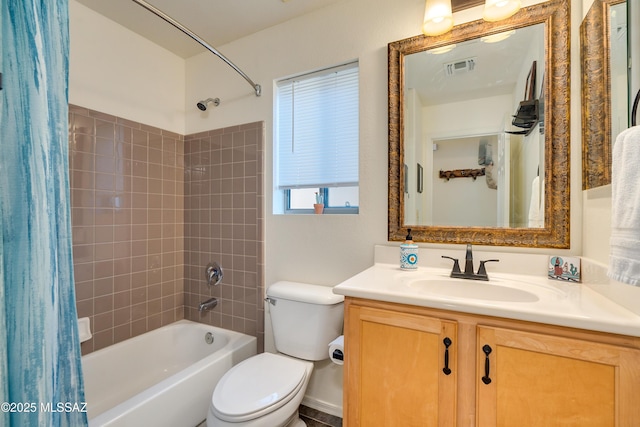 full bathroom featuring shower / tub combo with curtain, vanity, and toilet