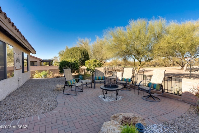 view of patio / terrace featuring a fire pit