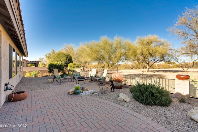 view of patio with an outdoor fire pit