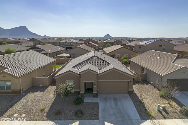 birds eye view of property with a mountain view