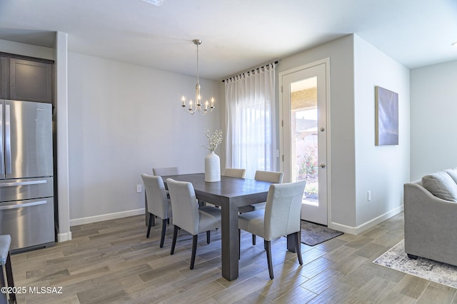 10139 N Sand Sage Trl, Marana, AZ 85653 - dining space with hardwood / wood-style flooring and a chandelier