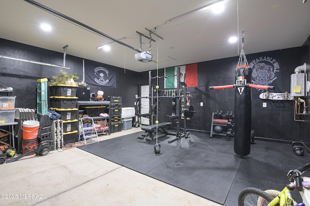 10139 N Sand Sage Trl, Marana, AZ 85653 - garage featuring a garage door opener, a workshop area, and water heater